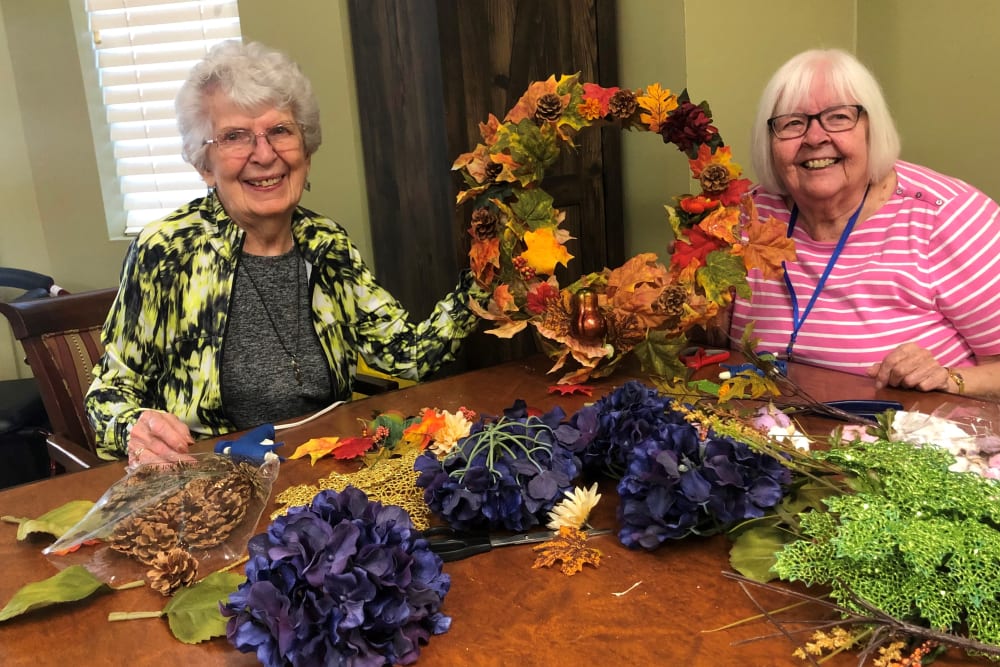 Two residents making a wreath at The Iris Senior Living in Great Falls, Montana. 