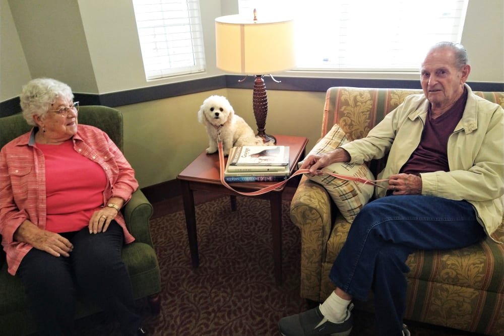 Two residents and a dog at The Iris Senior Living in Great Falls, Montana. 