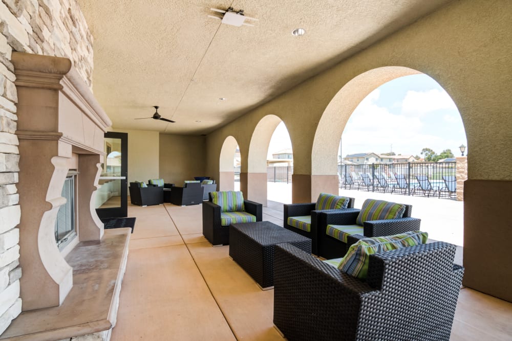 A covered outdoor lounge with seating at Edson in Oceanside, California