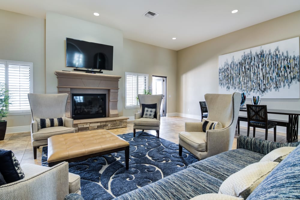 Clubhouse with seating and entertainment amenities at Edson in Oceanside, California