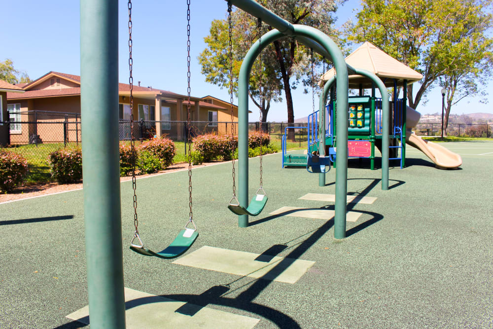 Swingsets at a playground at Canyon View in San Diego, California