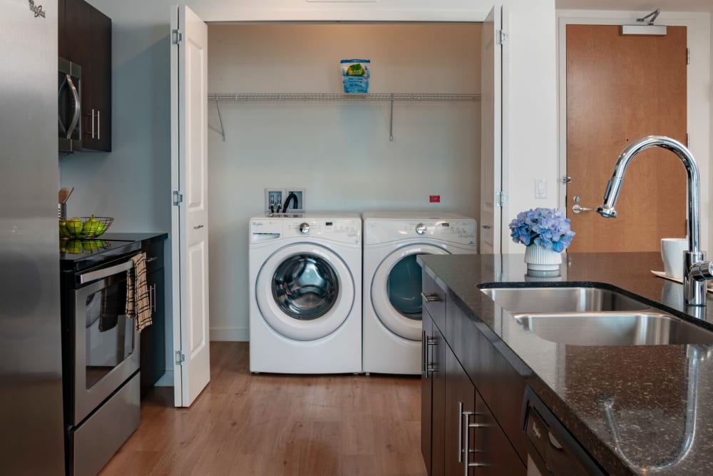 Full-size washer and dryer in a model home's kitchen pantry at CitiTower in Orlando, Florida