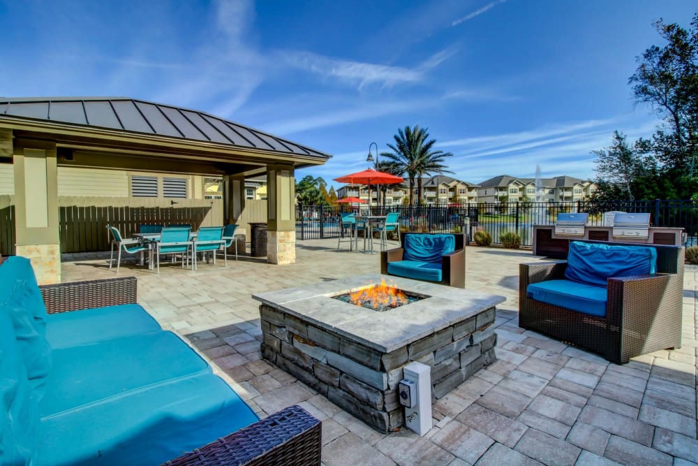 Outdoor lounge area and ping pong table at Seagrass Apartments in Jacksonville, Florida