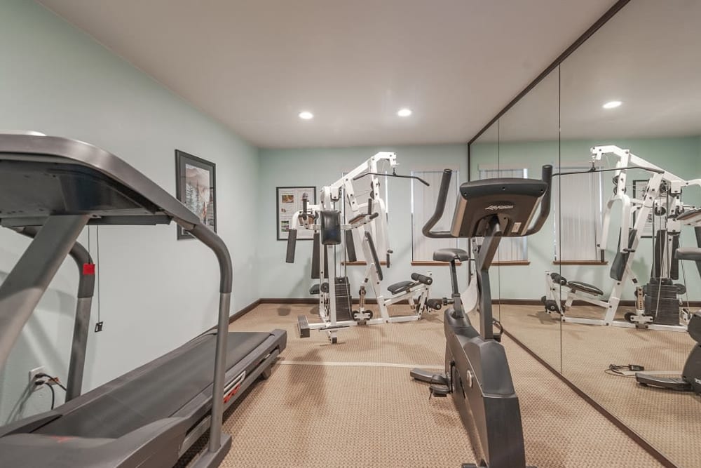 Fitness room with a couple cardio machines at Oswego Cove in Lake Oswego, Oregon