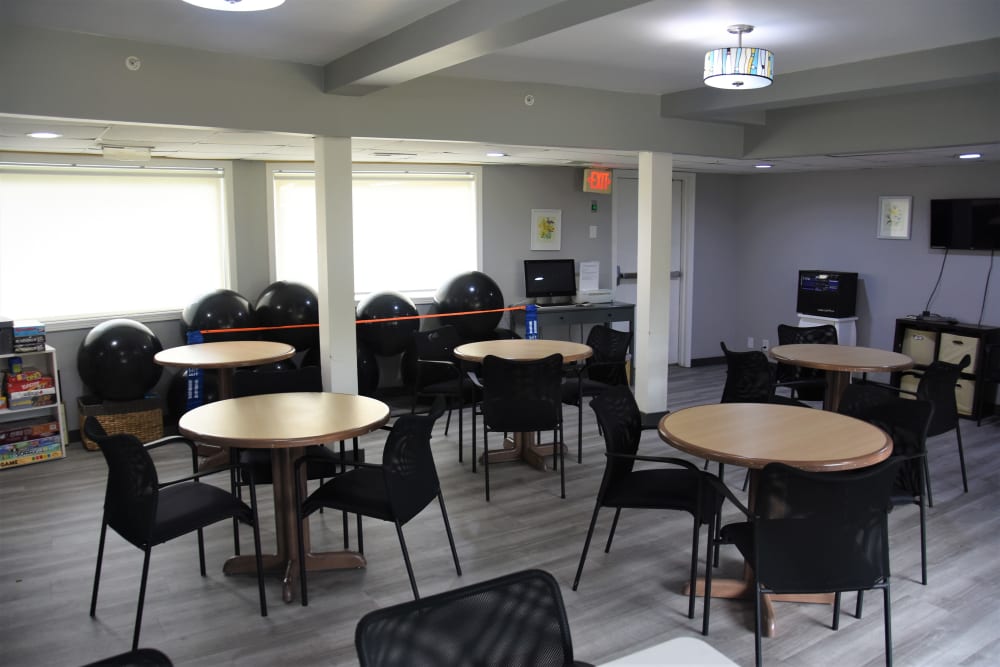 Activity room with books and computer workstation at Garnett Place in Cedar Rapids, Iowa.