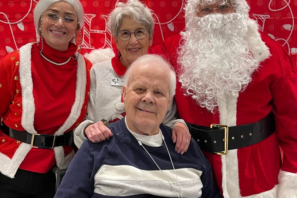 Blossom Springs resident and family picture with Santa during a holiday party. 