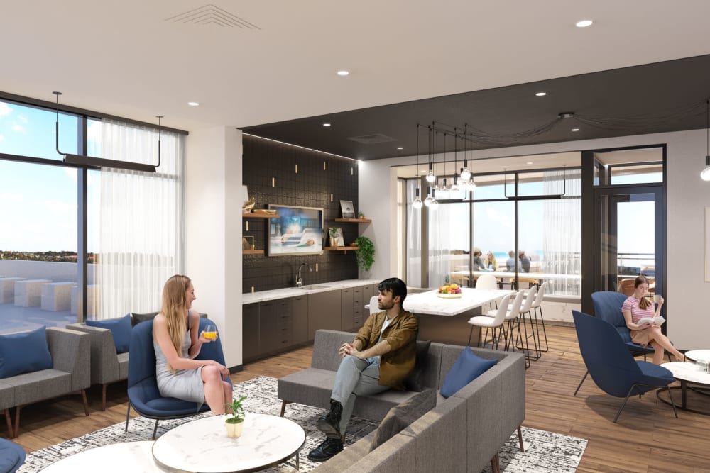 Floor-to-ceiling windows provide terrific views of the surrounding area from the clubhouse lounge at Anden in Weymouth, Massachusetts