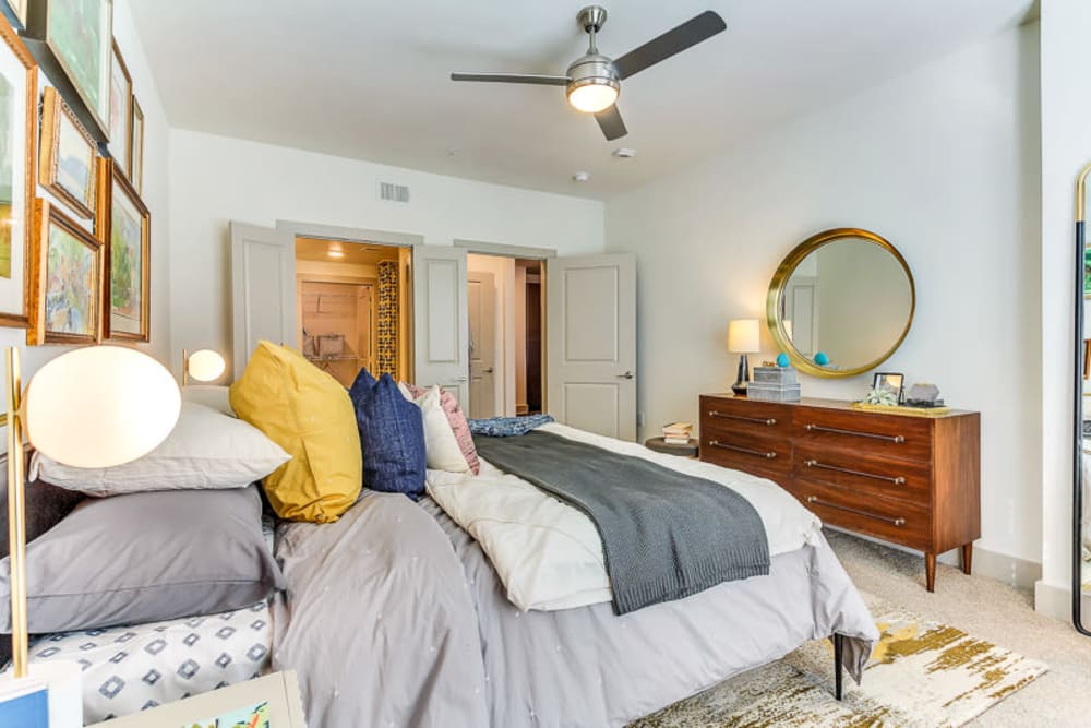 Cozy bedroom in a model home at The Nash in Dallas, Texas
