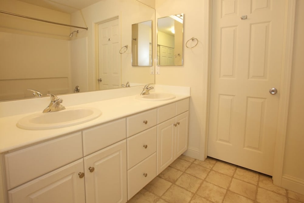 a tidy double-sinked bathroom at South Mesa I in Oceanside, California
