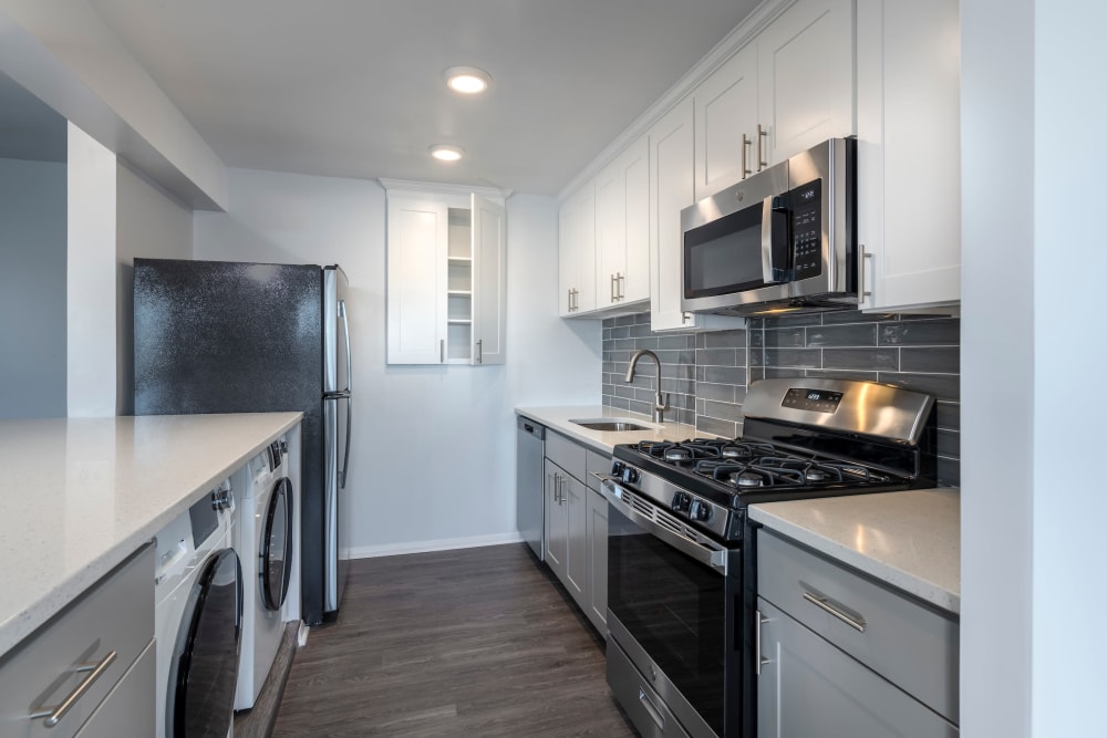 Fully equipped kitchen with stainless steel appliances at Ruxton Towers Apartments in Towson, Maryland