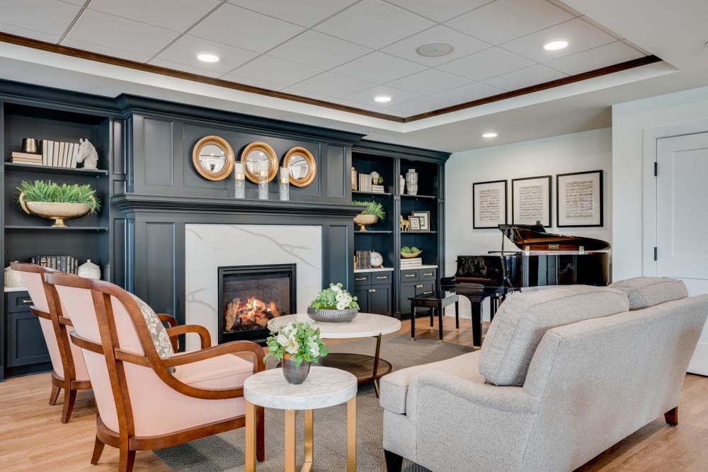Great room with a lounge area in front of the fireplace at Amira Choice Arvada in Arvada, Colorado