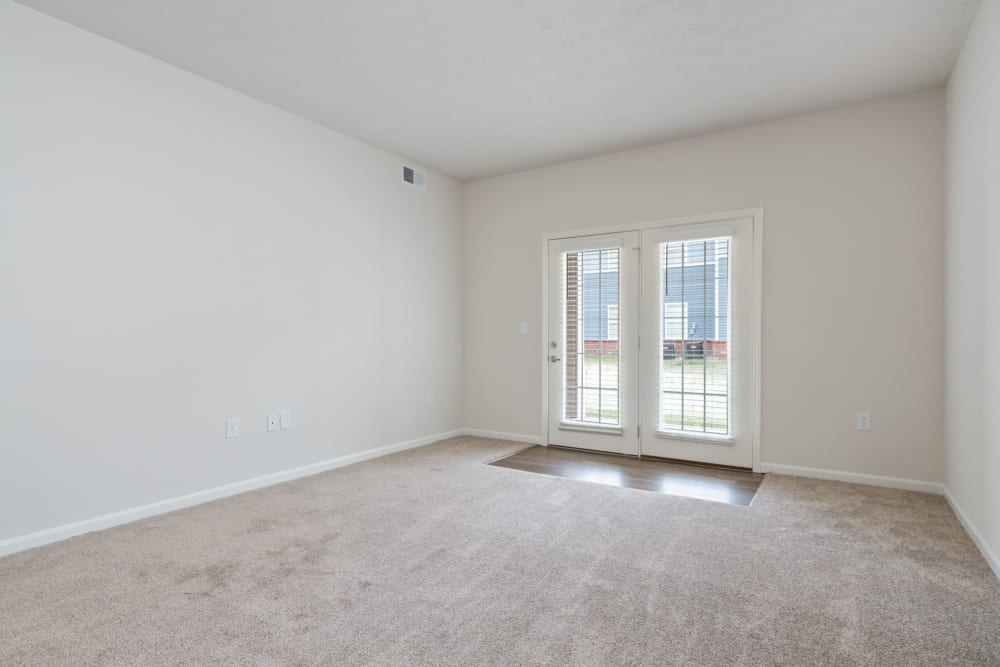 Spacious living room at Cane Run Station Apartments in Louisville, Kentucky