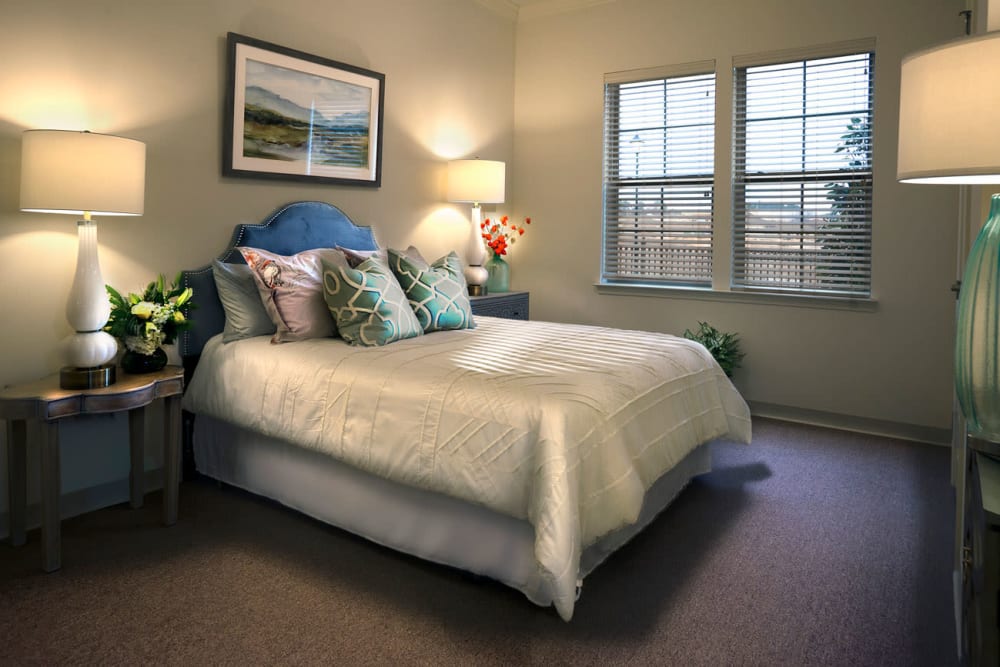large bed in a senior apartment at The Blake at Carnes Crossroads in Summerville, South Carolina