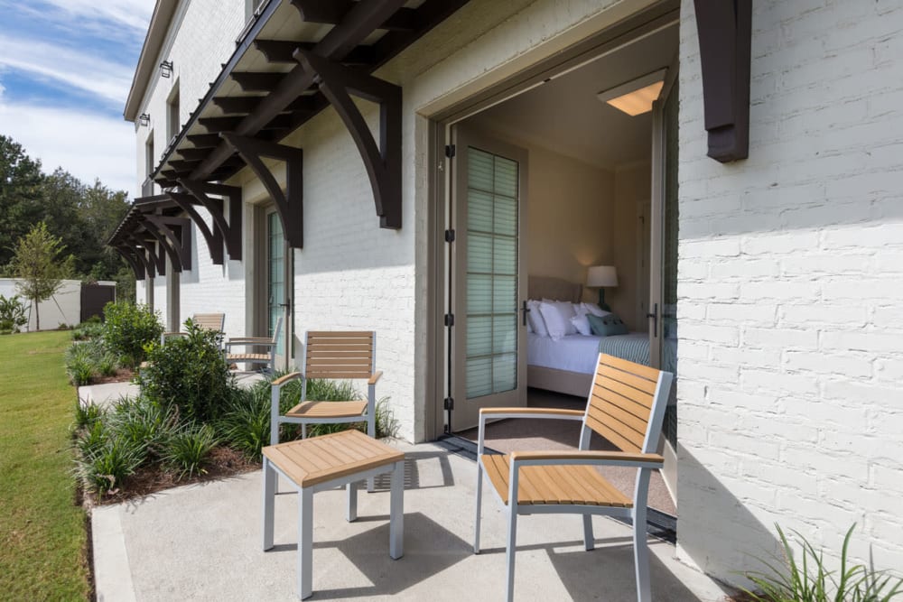 Apartment patio with deck chairs at The Blake at Charlottesville in Charlottesville, Virginia
