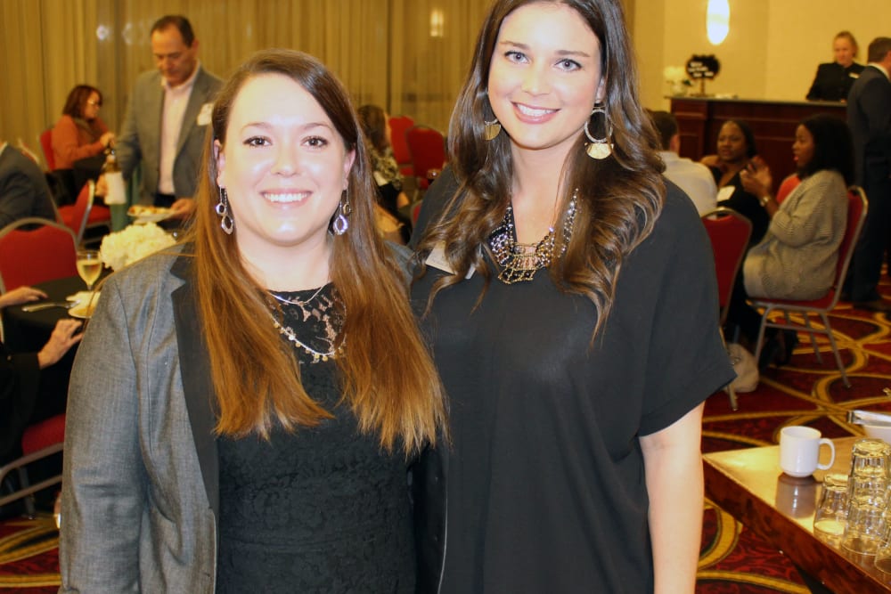 Two staff members dressed in black at The Blake at Colonial Club in Harahan, Louisiana