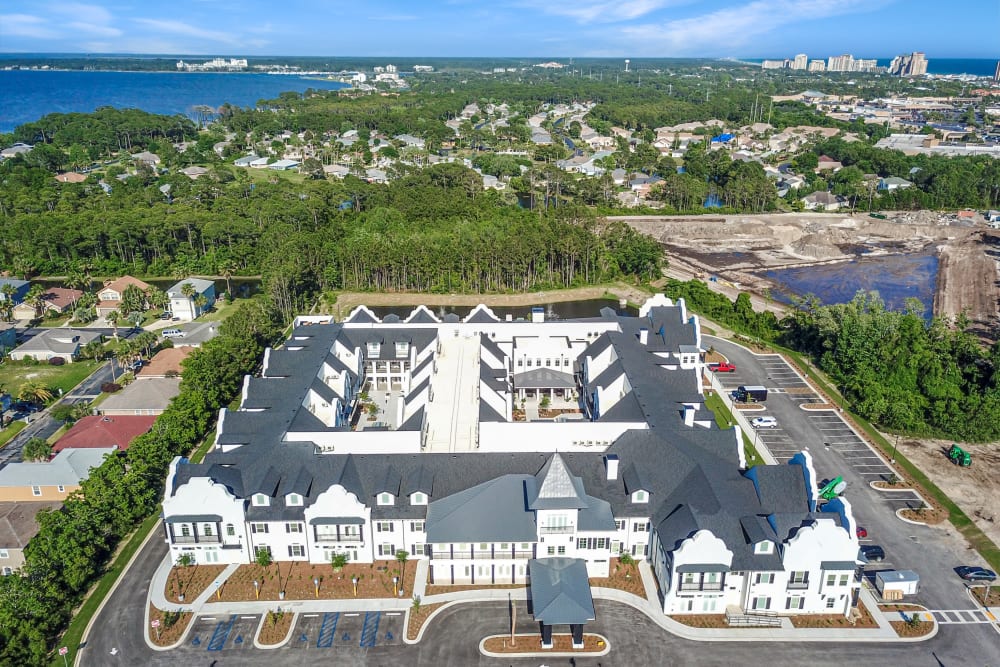 Community campus surrounded by lush trees at The Blake at Miramar Beach in Miramar Beach, Florida
