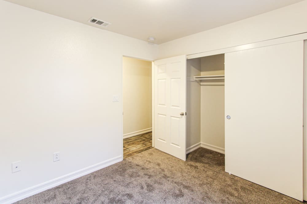 A bedroom with storage in a home at Howard Gilmore Terrace in La Mesa, California