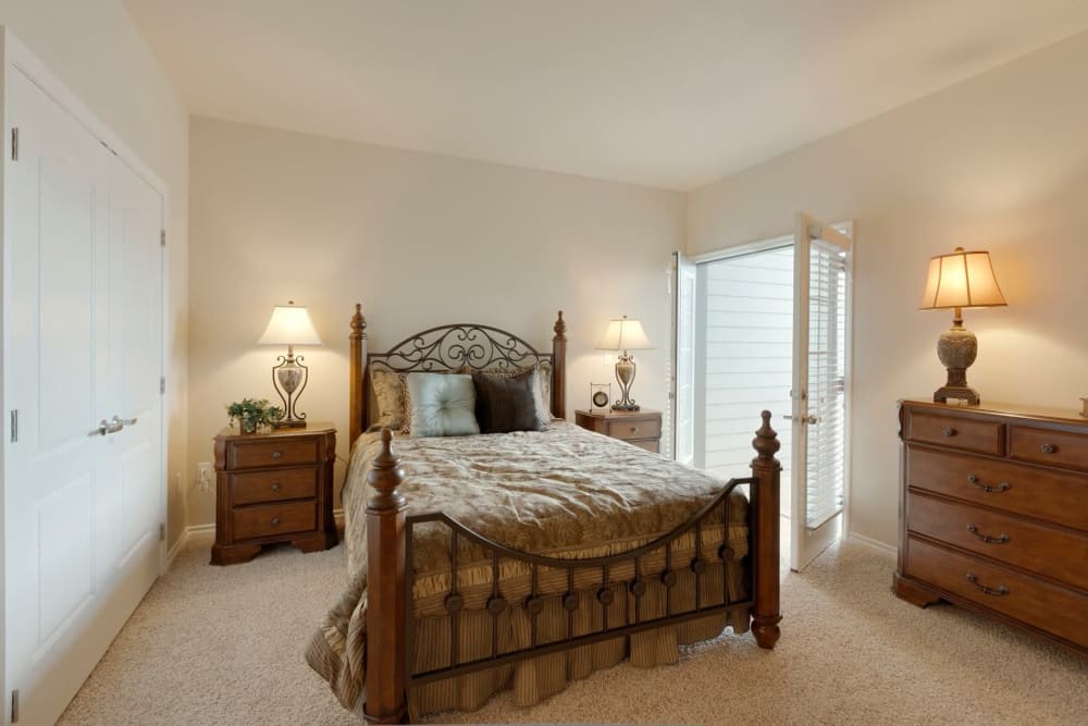Bedroom with access to balcony at The Preserve at Greenway Park in Casper, Wyoming
