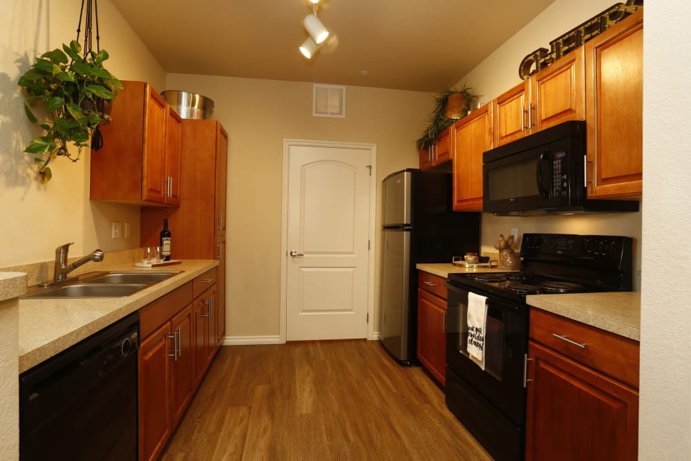 Model kitchen with wood flooring at The Preserve at Greenway Park in Casper, Wyoming