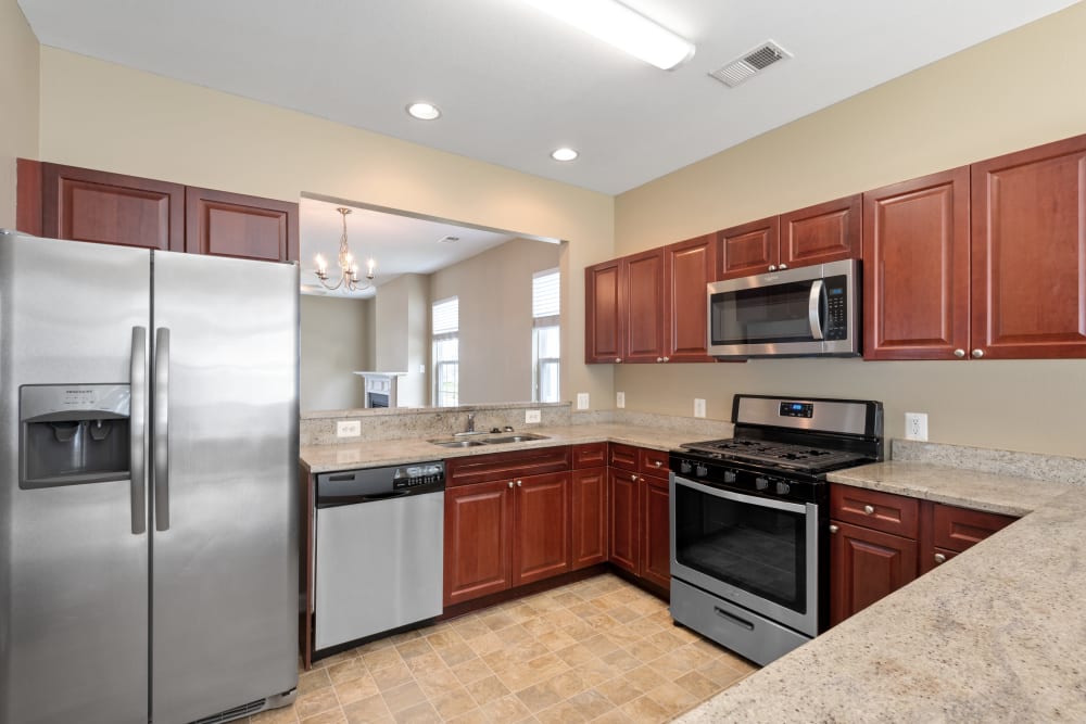 A kitchen with appliances in a home at Challenger Estates in Patuxent River, Maryland