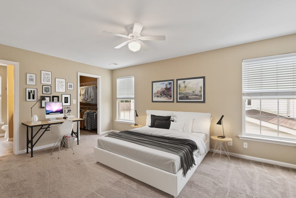 A bedroom with a walk-in closet in a home at Challenger Estates in Patuxent River, Maryland