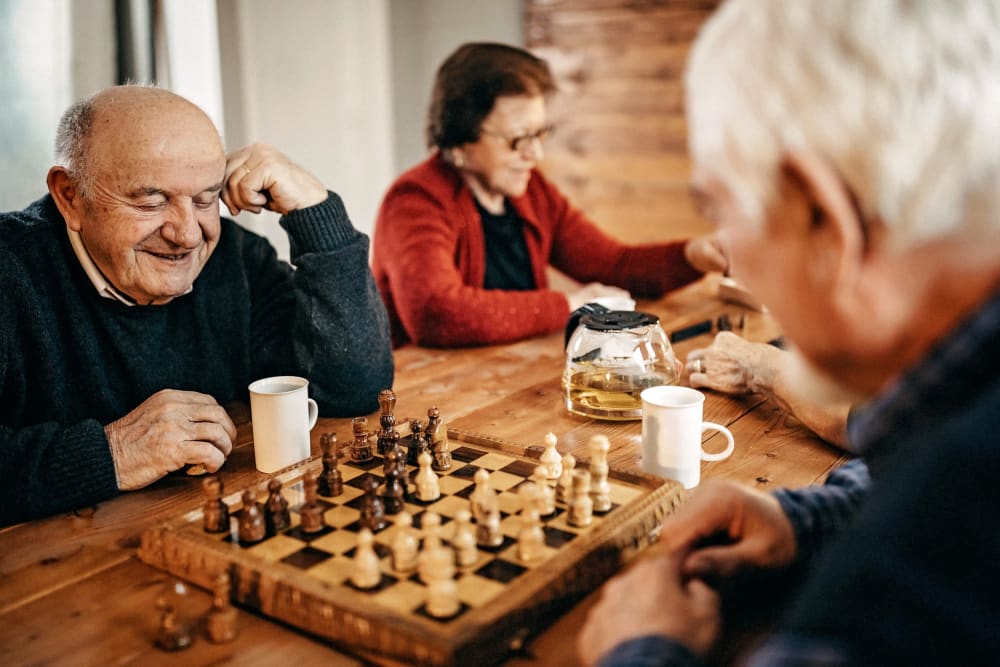 Residents playing chess in the game room at Belmare Senior Living in Oakdale, California