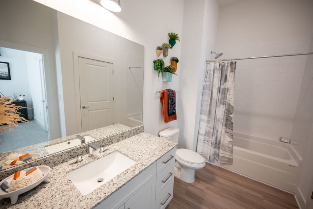 Bathroom with granite countertops at The Enzo at Ariston in Buford, Georgia