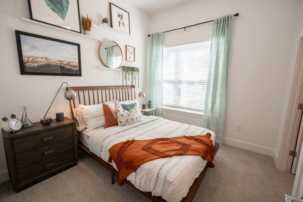 Model bedroom with natural light at The Enzo at Ariston in Buford, Georgia