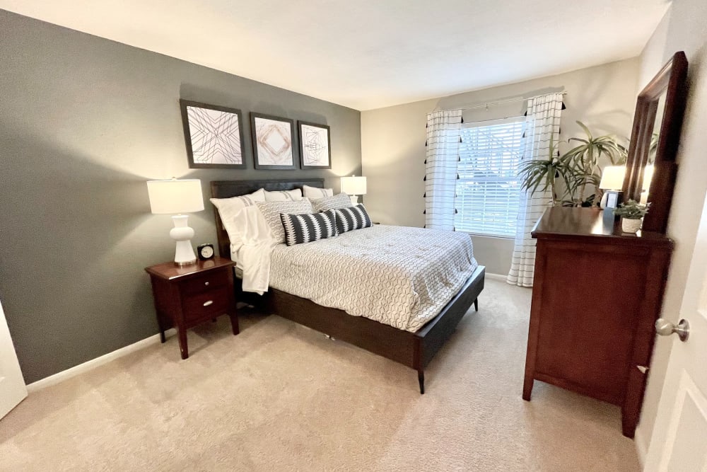 Bedroom with a window and ample lighting at The Abbey at Energy Corridor in Houston, Texas