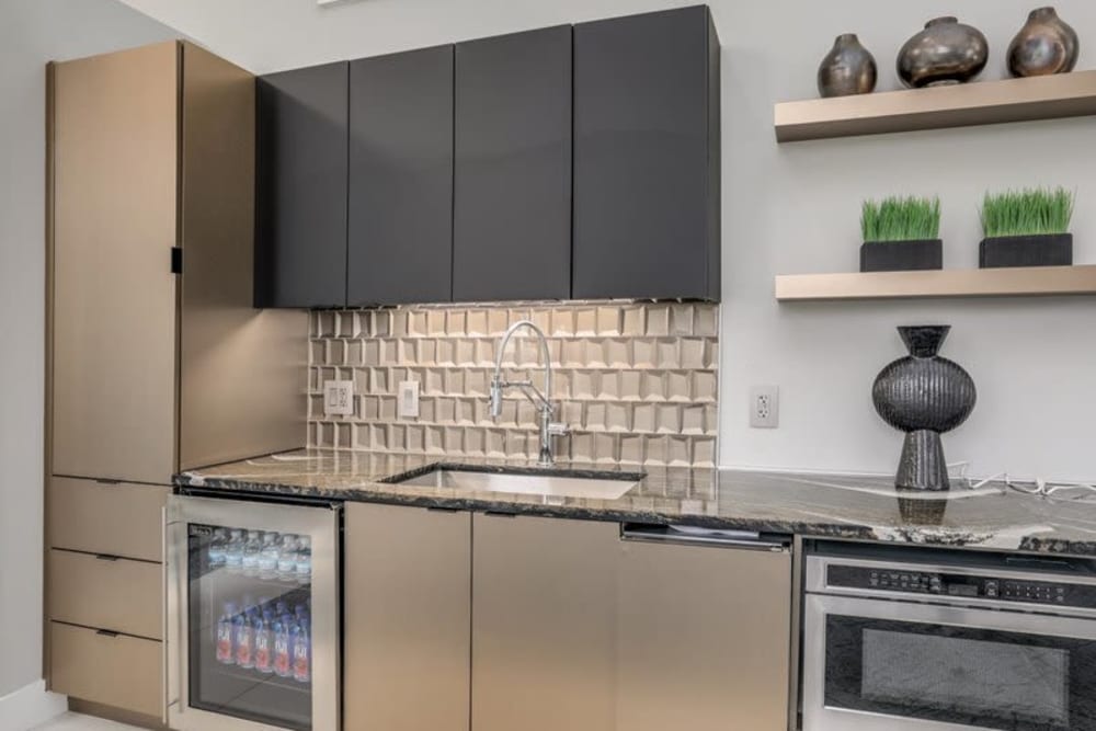 Sleek modern kitchen in the clubhouse at Briar Cove Terrace Apartments in Ann Arbor, Michigan