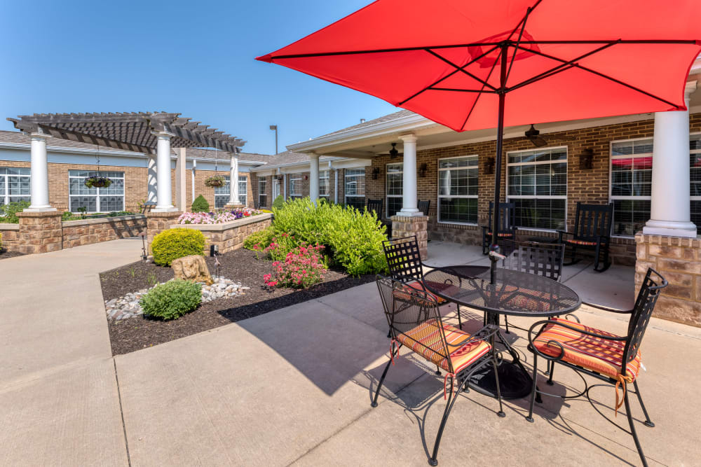 Covered seating on the patio at Addington Place of Shoal Creek in Kansas City, Missouri