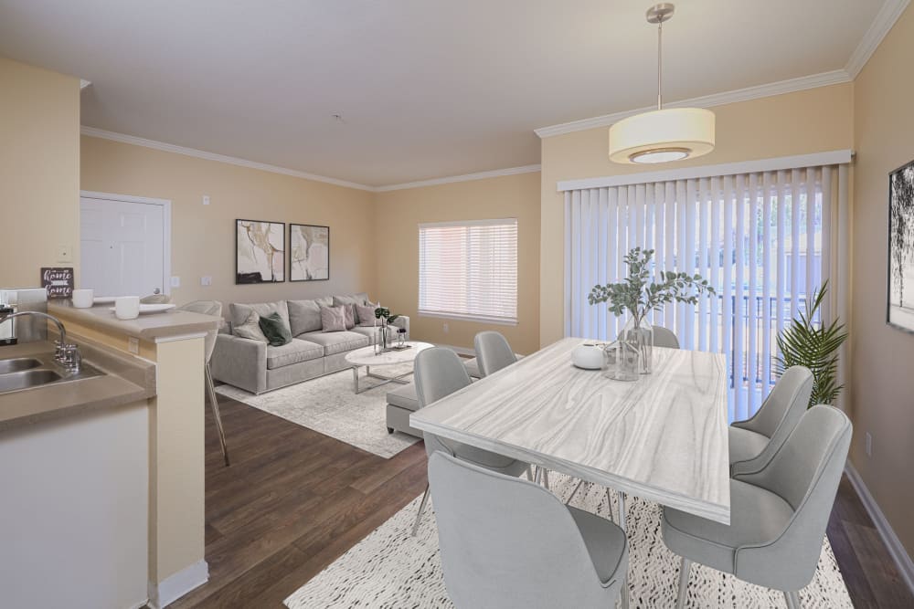 Living room and dining room with white accents at Skyecrest Apartments in Lakewood, Colorado