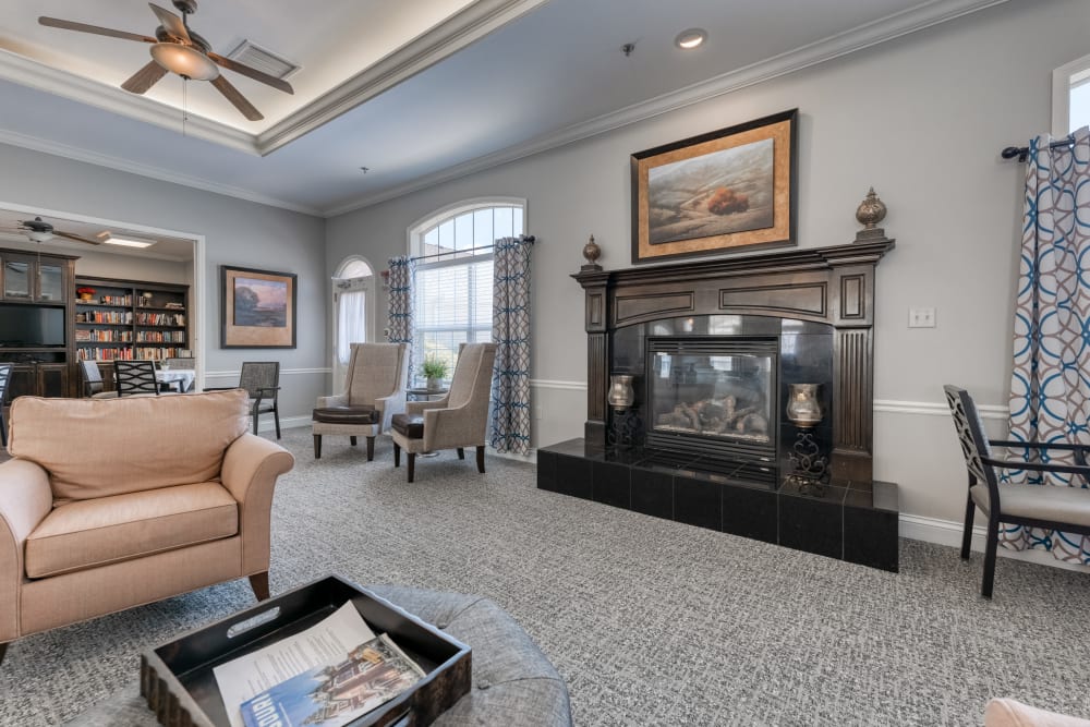 Fireplace lounge at Addington Place of Prairie Village in Prairie Village, Kansas