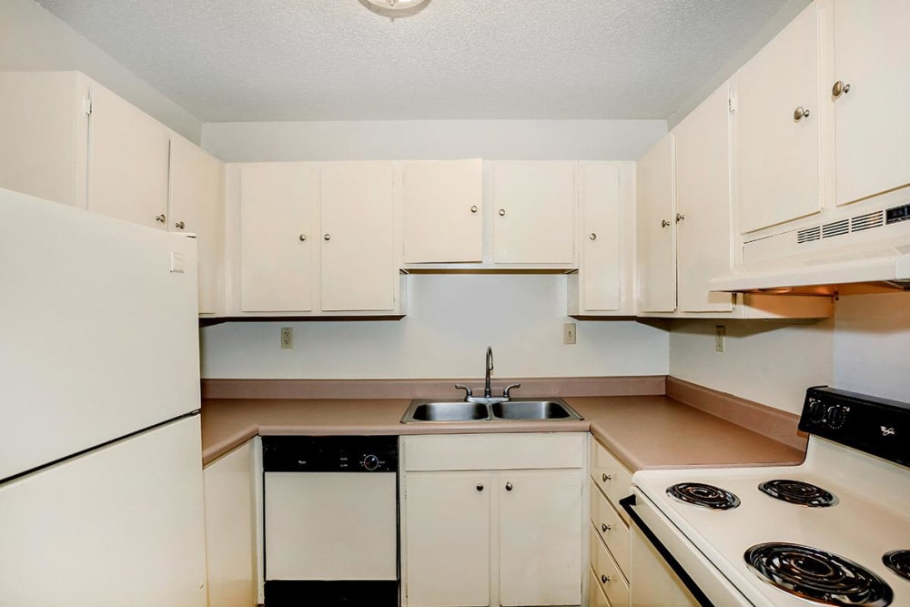 Kitchen with white cabinets at Patrician Terrace Apartment Homes in Jackson, Tennessee