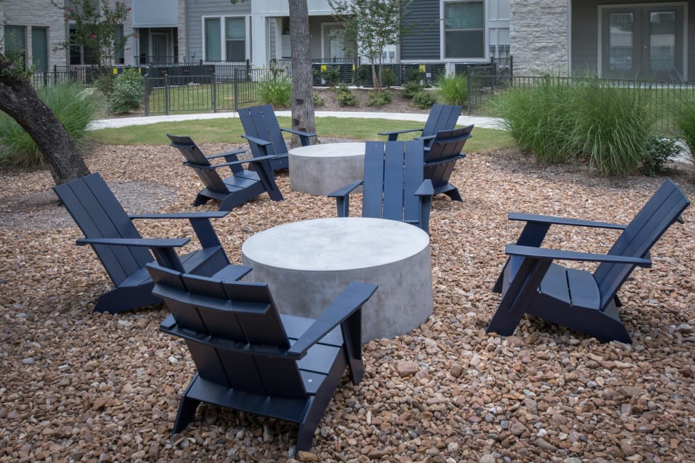 Community seating with tables outside at Marquis Dominion in San Antonio, Texas