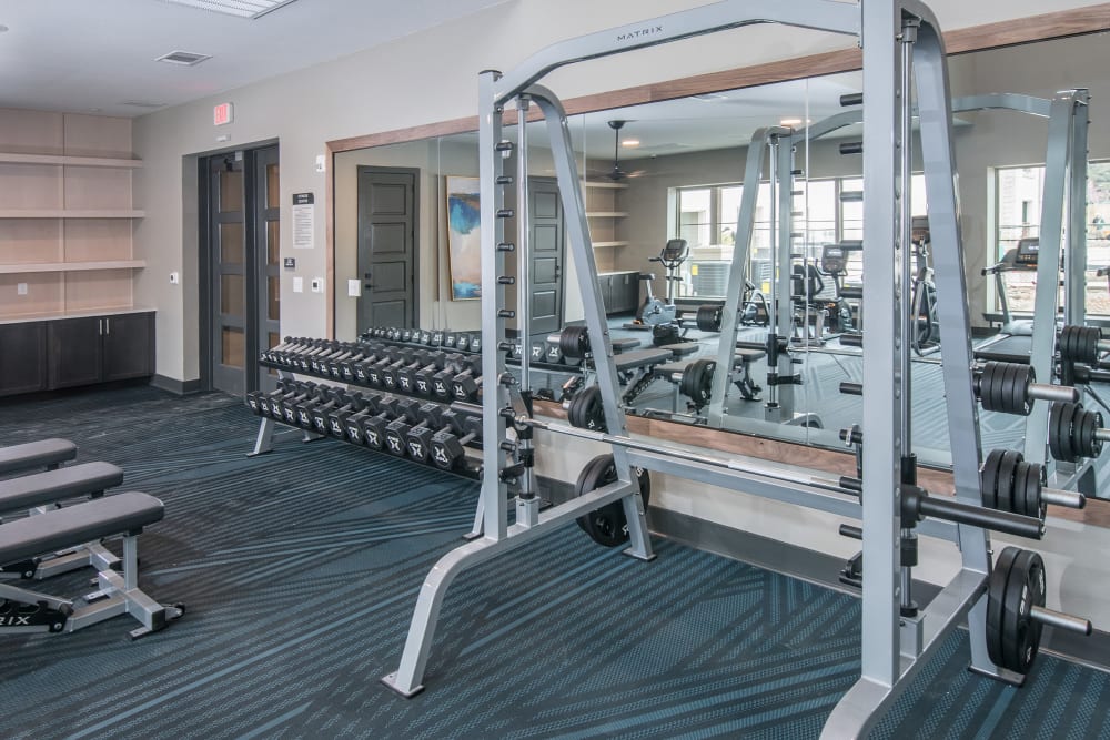 Gym equipment with mirror behind for residents at Marquis Dominion in San Antonio, Texas