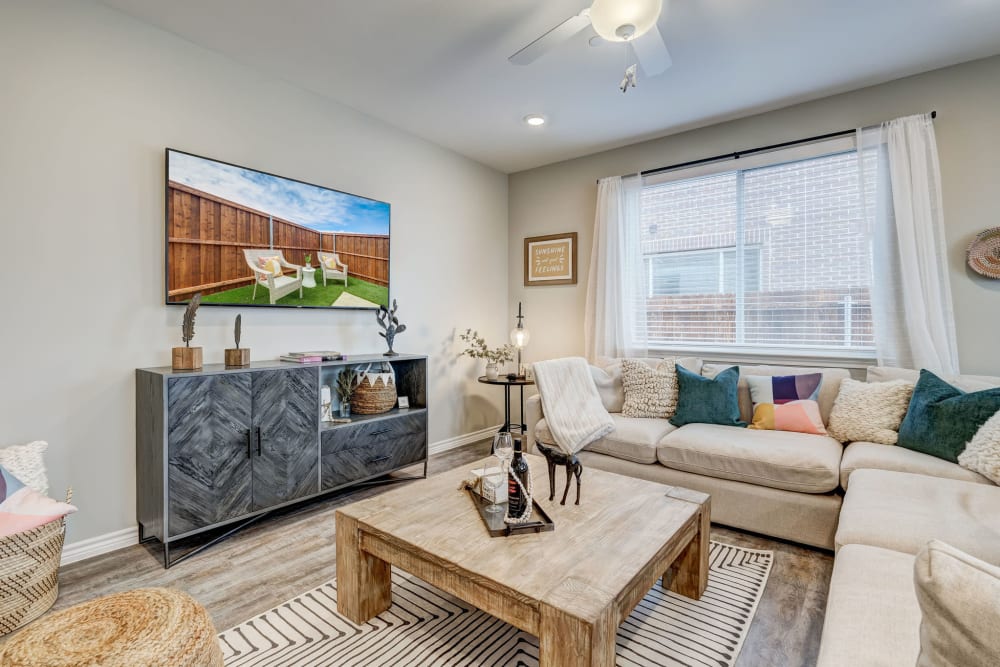 Cute and cozy living room in a spacious model home at BB Living Light Farms in Celina, Texas