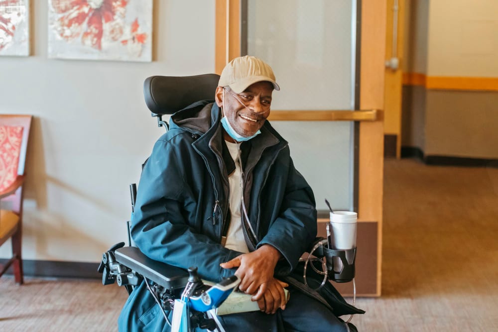 Happy resident posing for a photo at Cascade Park Vista Assisted Living in Tacoma, Washington