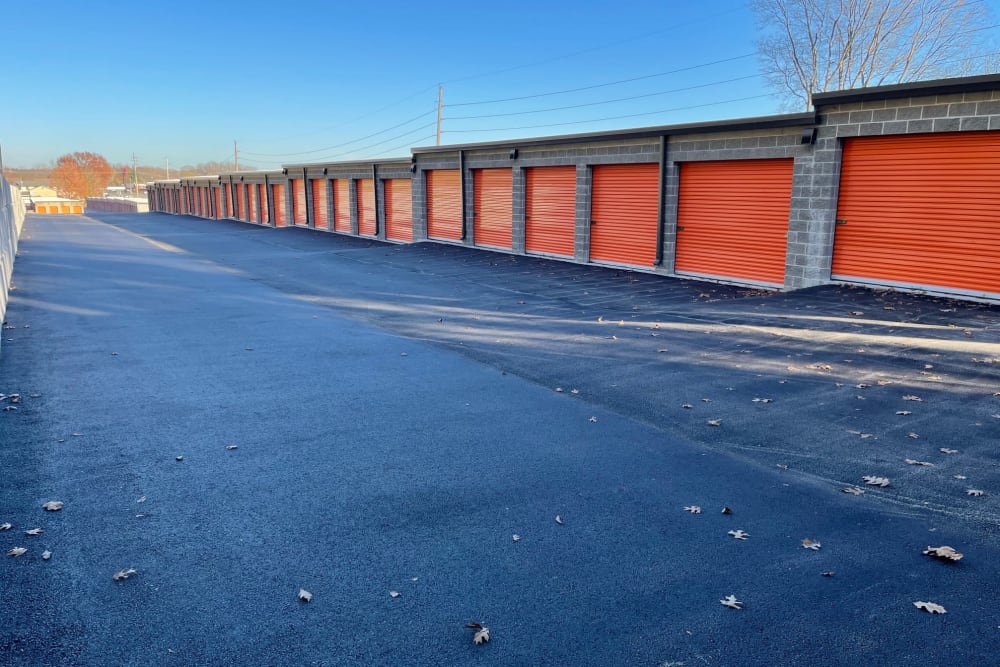 Row of units with orange garage doors at Arnold/Fenton in Fenton, Missouri