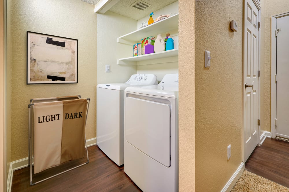 Side by side washer and dryer at Arapahoe Club Apartments in Denver, Colorado