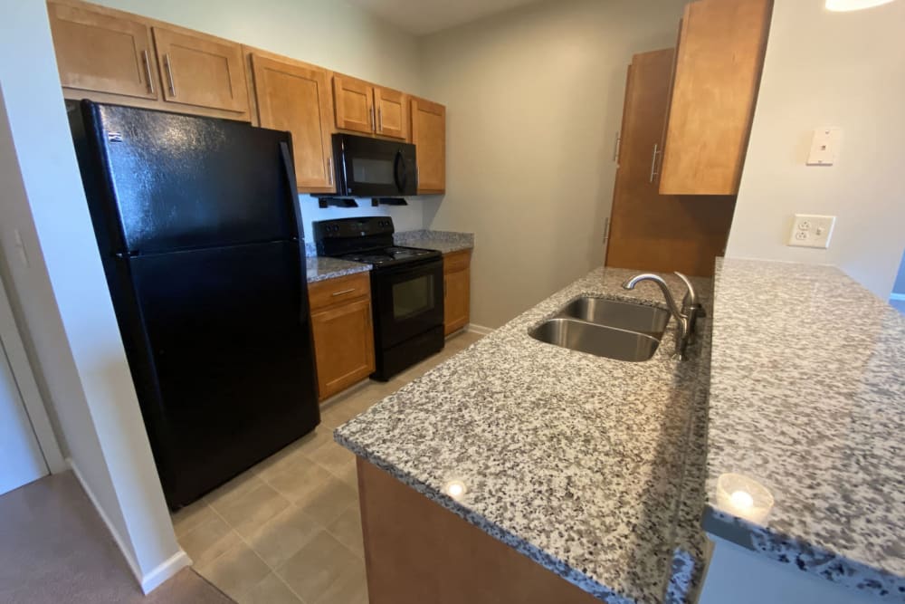 Granite countertops in an apartment's kitchen at Rivers Pointe Apartments in Liverpool, New York