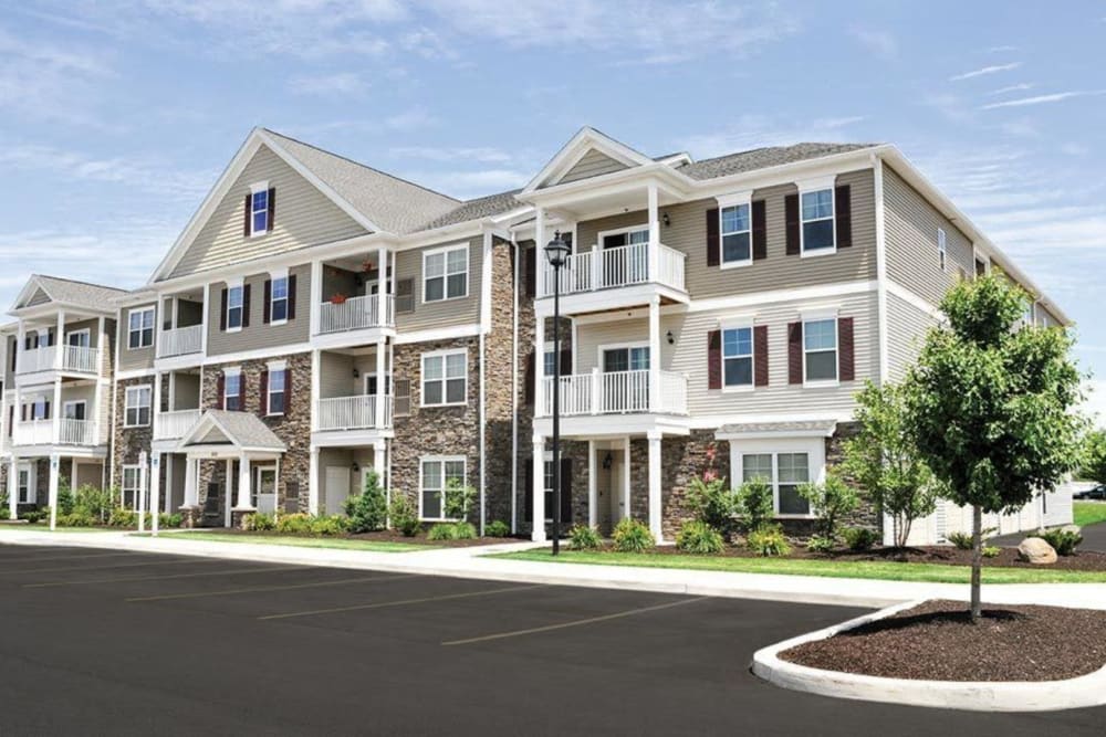 Resident buildings and professionally maintained landscaping at Rivers Pointe Apartments in Liverpool, New York