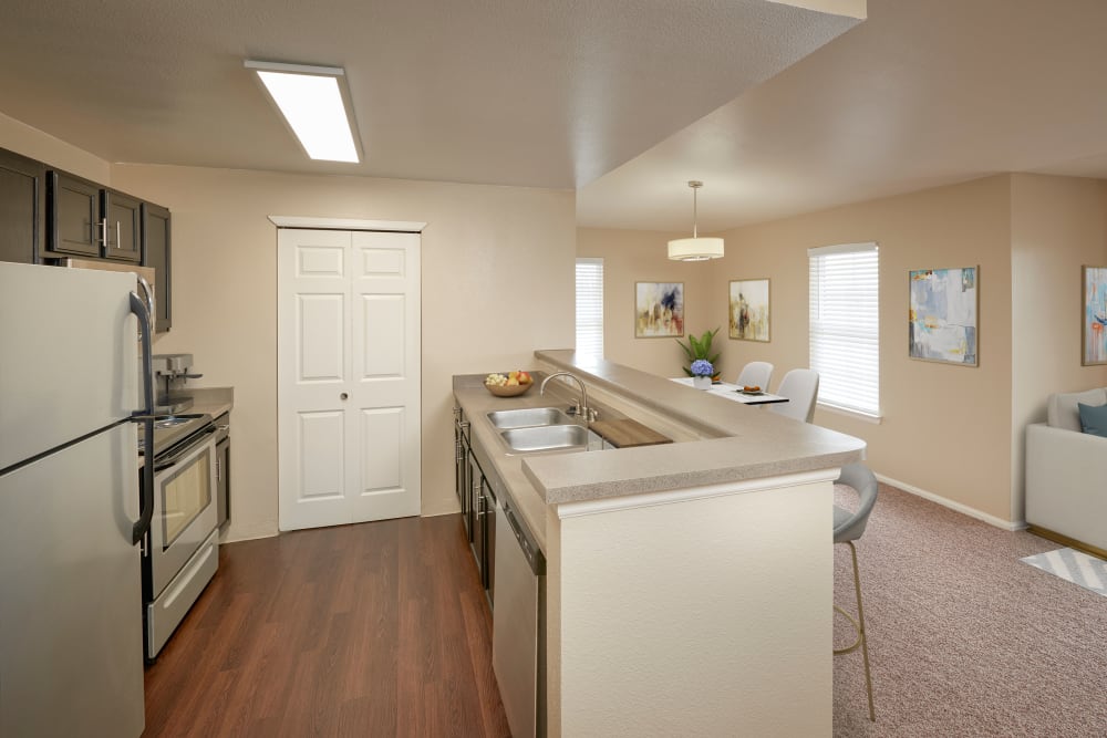 A kitchen with plenty of cabinet space at Westridge Apartments in Aurora, Colorado