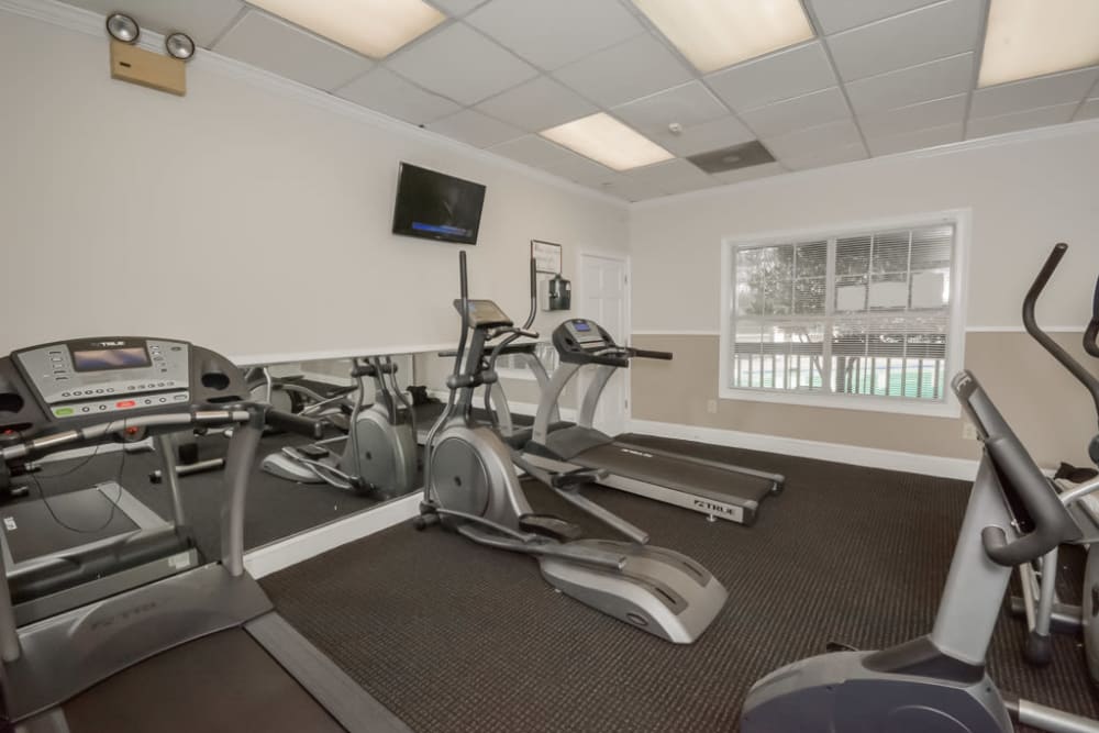 Fitness center for residents to work out in at Arbor Crossing Apartments in Lithonia, Georgia