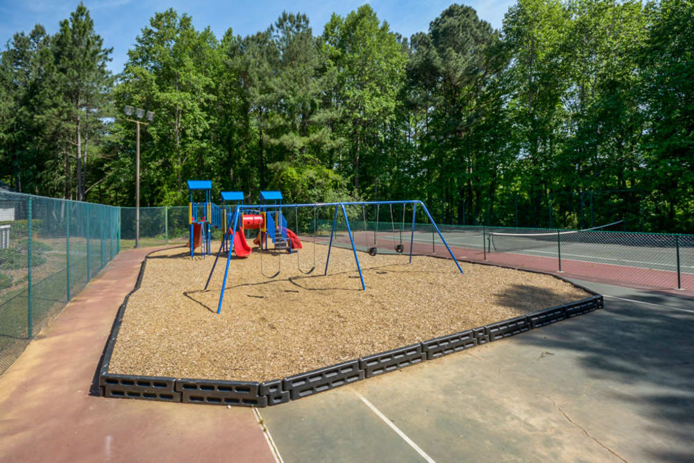 Kids playground next to the pool at Arbor Crossing Apartments in Lithonia, Georgia