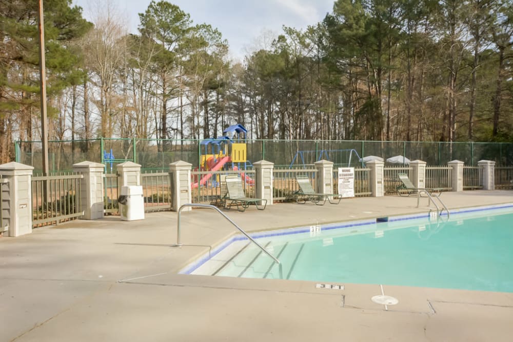Refreshing swimming pool at Arbor Crossing Apartments in Lithonia, Georgia