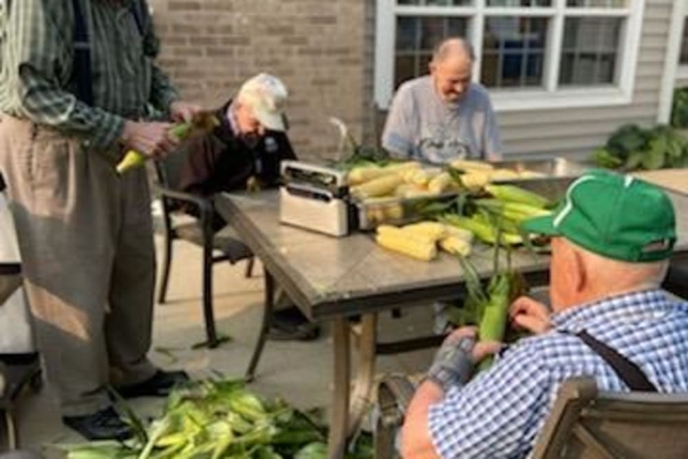 Residents preparing corn at Clover Ridge Place in Maquoketa, Iowa.