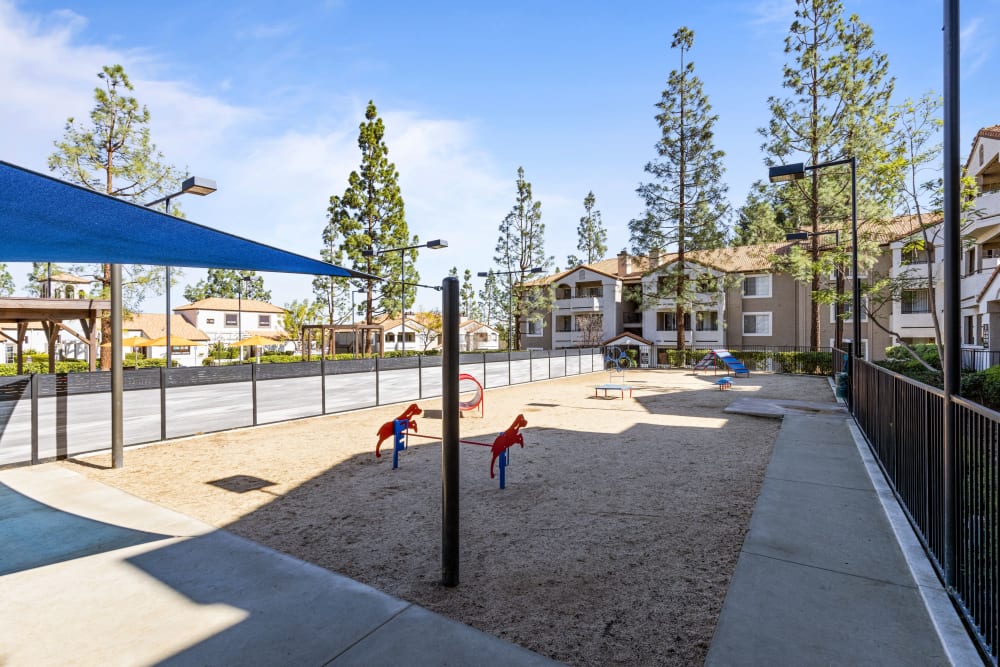 Have fun with your furry friend in the dog park at Sierra Del Oro Apartments in Corona, California