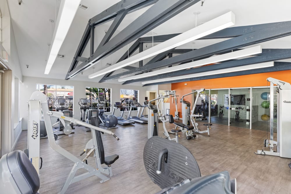 Clean, modern community gym at Sierra Del Oro Apartments in Corona, California
