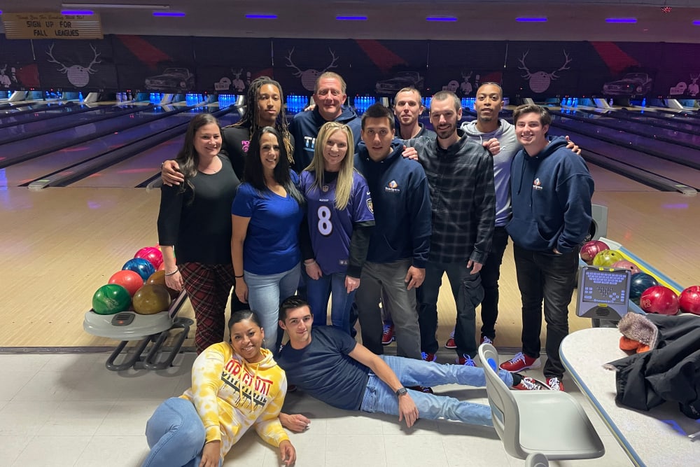 The team at Peak Management bowling together